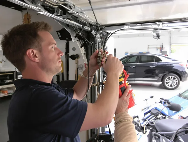 Swansea Garage Door Repair safety certified technician performing cable replacement in Swansea