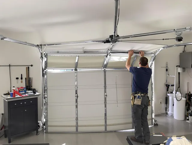 Swansea Garage Door Repair specialist performing precise section replacement on Swansea garage door